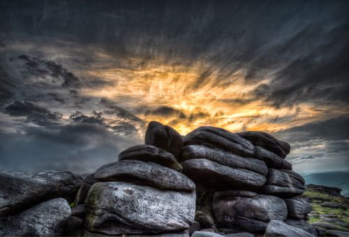 SUN SETTING BEHIND SHELTER ROCK by John Rutherford