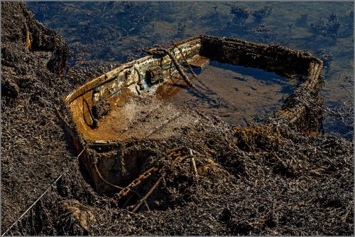 GROUNDED BOAT by John Rutherford